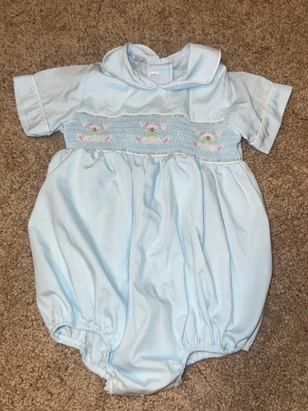 Baby blue smocked romper with embroidered floral design size 24m
